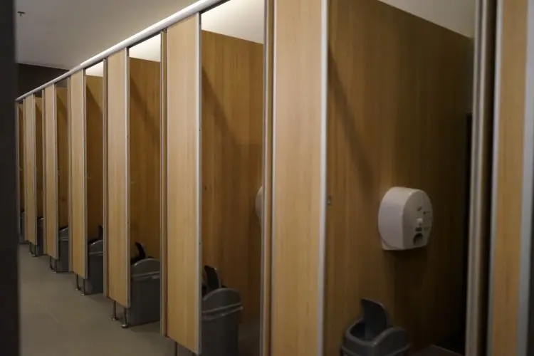 Empty toilet paper in the men's restroom