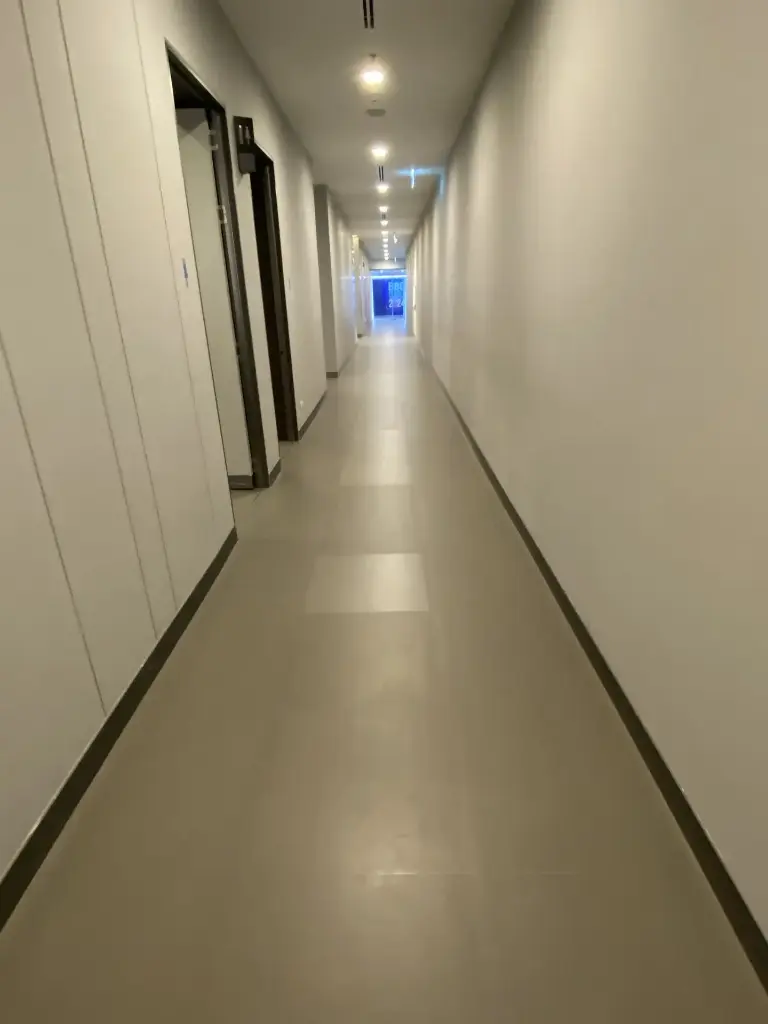 The emergency exit sign in the corridor is not working.