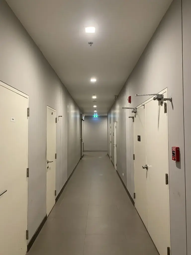 The door lock or latch in the corridor area is damaged.